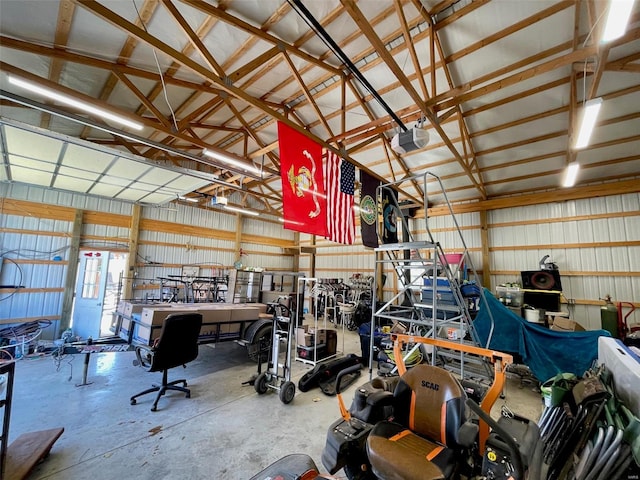 garage with a garage door opener and a workshop area