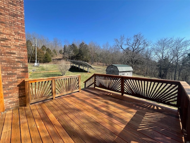 wooden terrace with a storage shed