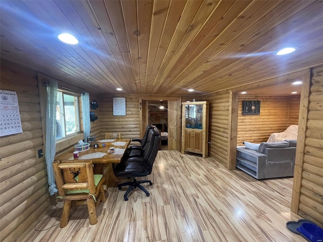 office space with light wood-type flooring, rustic walls, and wooden ceiling