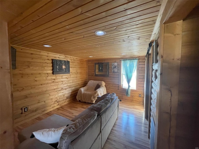 living room featuring wood-type flooring, wooden ceiling, and wooden walls