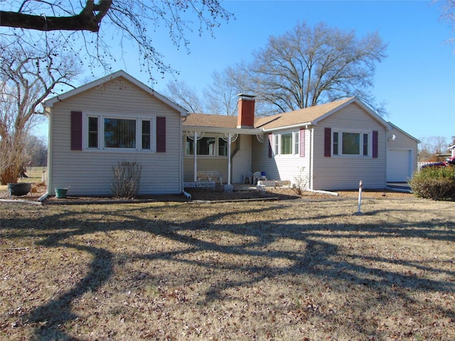 back of house with a yard