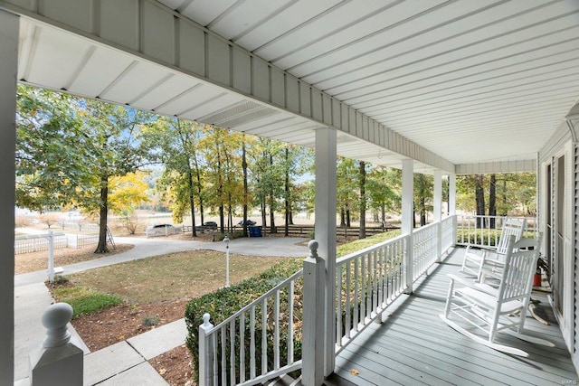 wooden terrace featuring covered porch