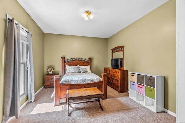 bedroom with carpet flooring and baseboards