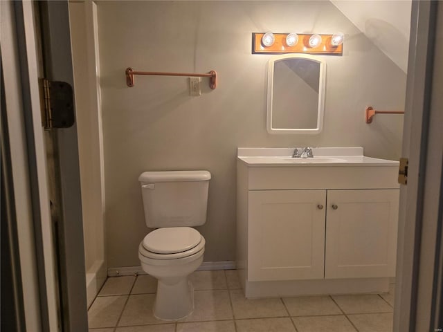 bathroom with tile patterned flooring, toilet, vanity, and baseboards