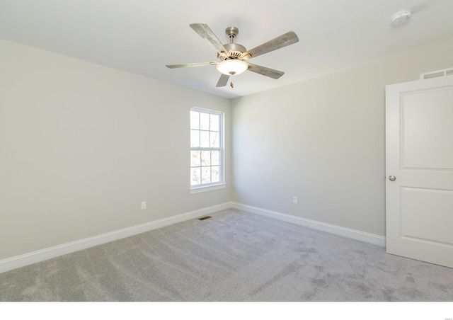 carpeted empty room with ceiling fan