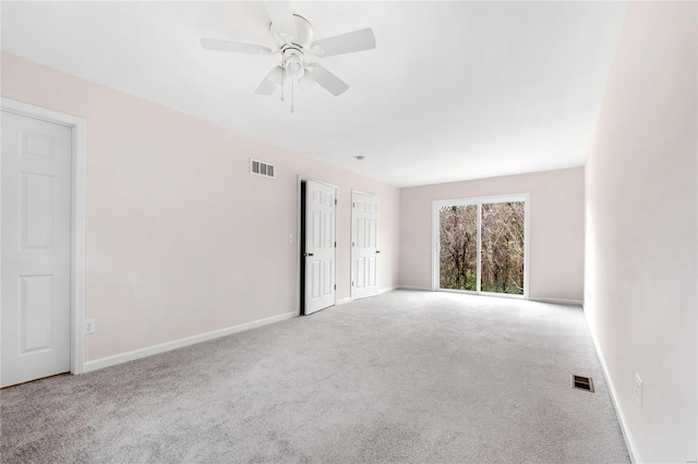 empty room featuring carpet and ceiling fan