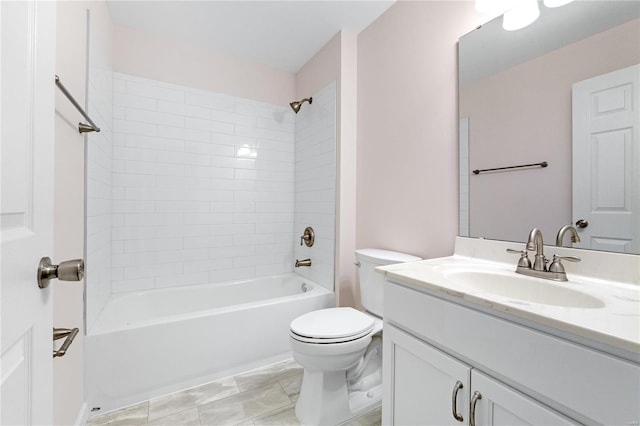 full bathroom featuring vanity, toilet, and tiled shower / bath combo