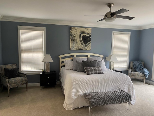 bedroom featuring ornamental molding, ceiling fan, and dark colored carpet