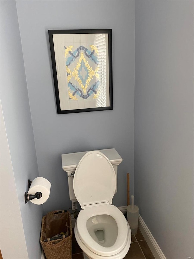 bathroom with toilet and tile flooring