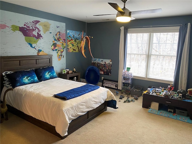 bedroom with ceiling fan and carpet