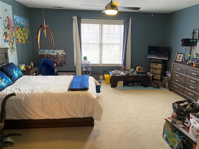 carpeted bedroom featuring ceiling fan