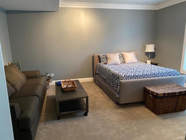 carpeted bedroom featuring ornamental molding