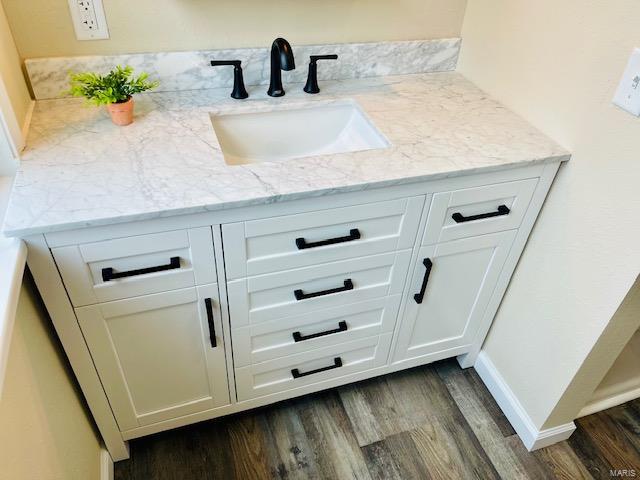 bathroom featuring vanity and hardwood / wood-style floors