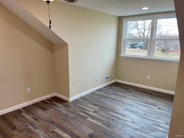 unfurnished room featuring dark hardwood / wood-style floors