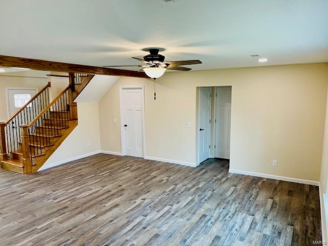 unfurnished room featuring ceiling fan and wood-type flooring