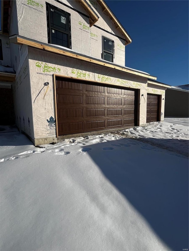 view of snow covered garage