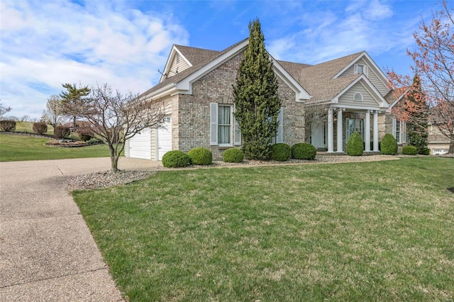 view of front of house with a front yard and a garage