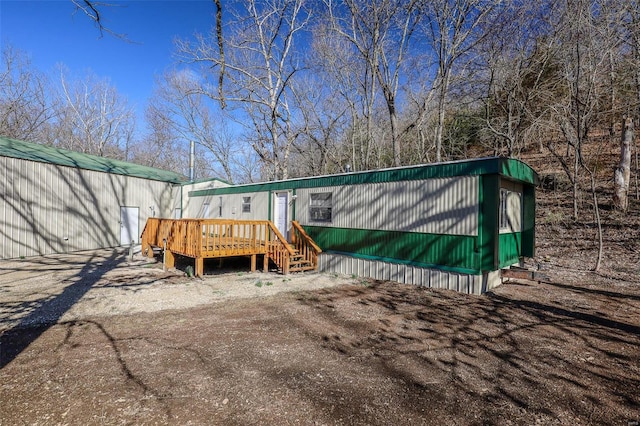 exterior space featuring a wooden deck