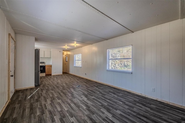 empty room with dark hardwood / wood-style floors