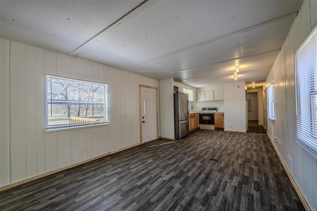 unfurnished living room with dark wood-type flooring