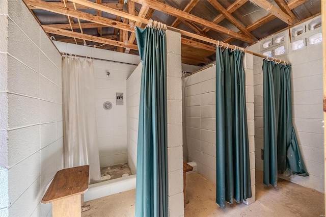 bathroom featuring a shower with curtain