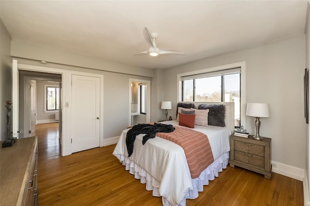 bedroom featuring hardwood / wood-style flooring and ceiling fan