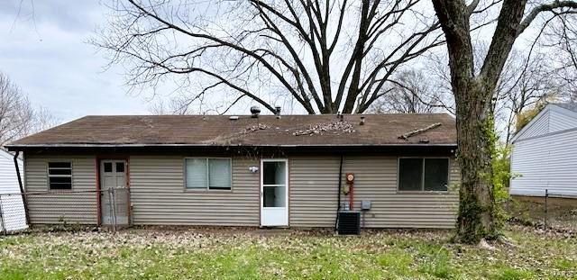 back of house featuring central AC unit