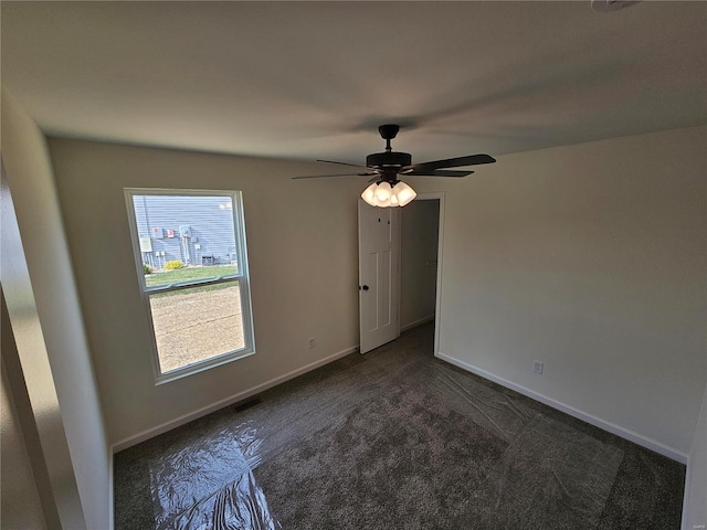 carpeted empty room with ceiling fan