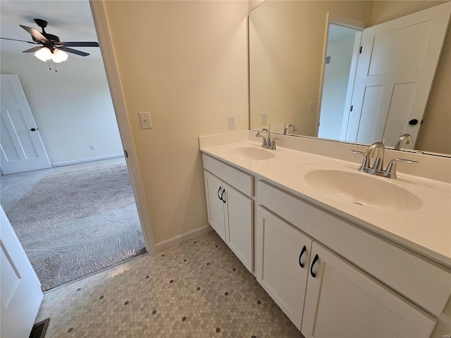 bathroom featuring ceiling fan and vanity