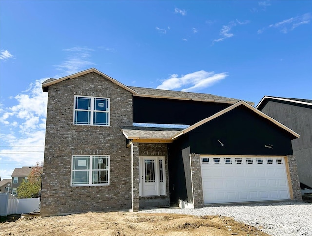 front of property with a garage