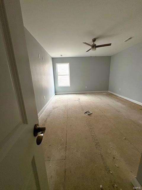 spare room featuring ceiling fan