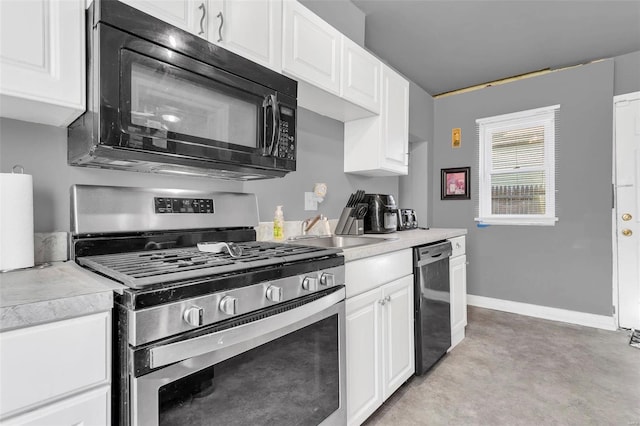 kitchen featuring white cabinetry, sink, and black appliances