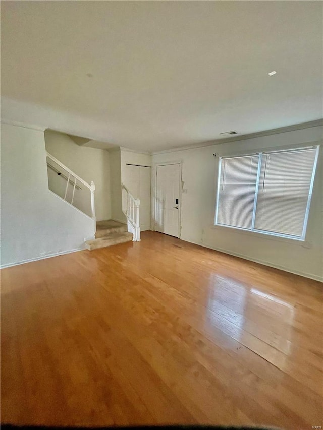 unfurnished room featuring hardwood / wood-style flooring