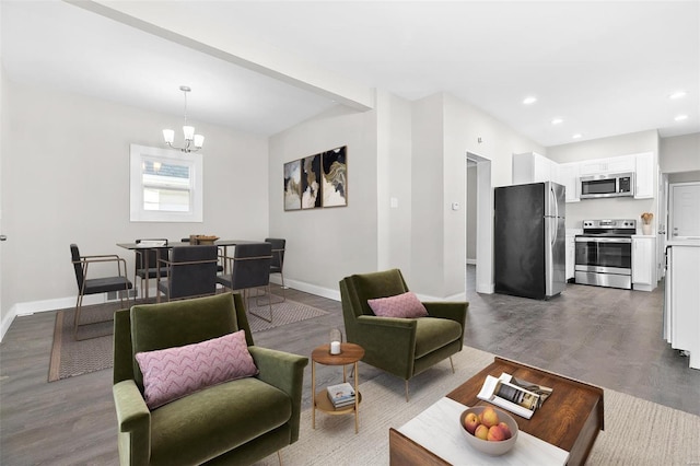 living room featuring hardwood / wood-style floors and a notable chandelier