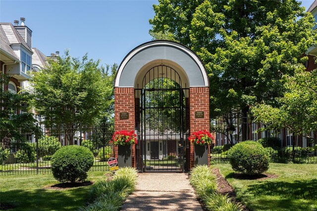 entrance to property featuring a yard