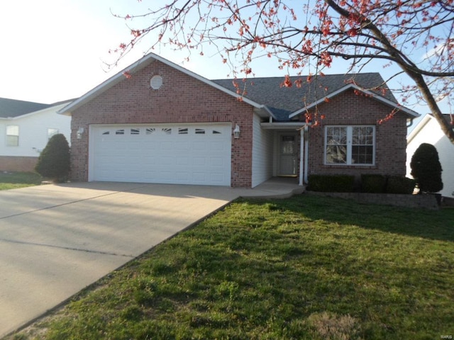 ranch-style home with a front yard and a garage