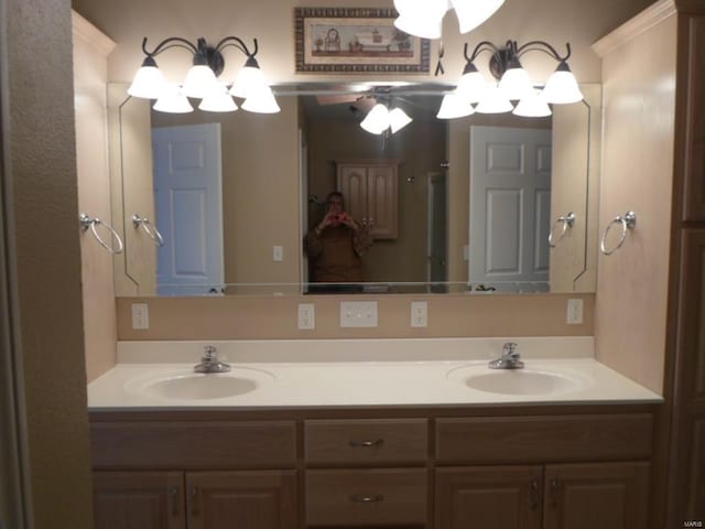 bathroom featuring ceiling fan and dual vanity