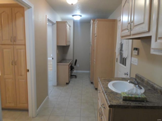 bathroom featuring tile floors and vanity