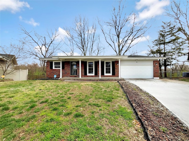 single story home featuring a front yard and a garage