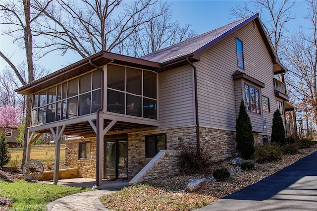 exterior space featuring a sunroom