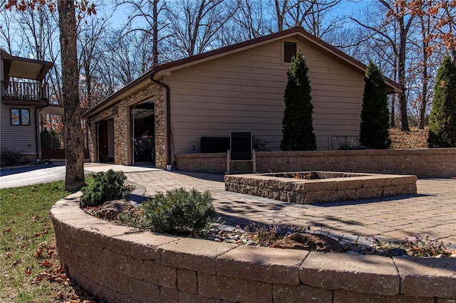 view of home's exterior with a patio