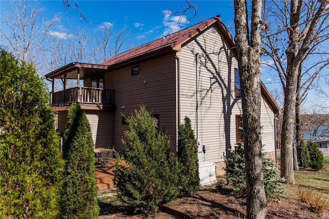 view of property exterior featuring a balcony