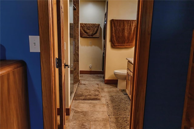 bathroom with vanity, tile patterned floors, and toilet