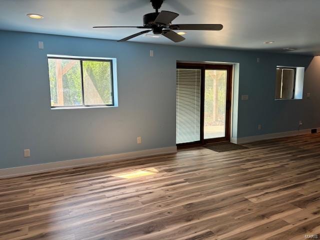 unfurnished room featuring ceiling fan and hardwood / wood-style floors