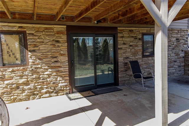 doorway to property featuring a patio