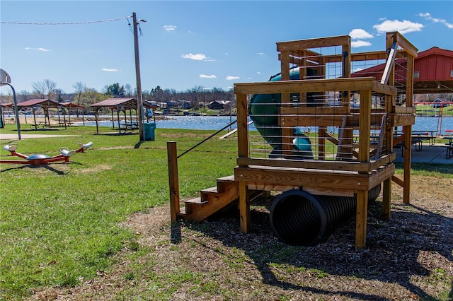 view of playground with a water view and a yard