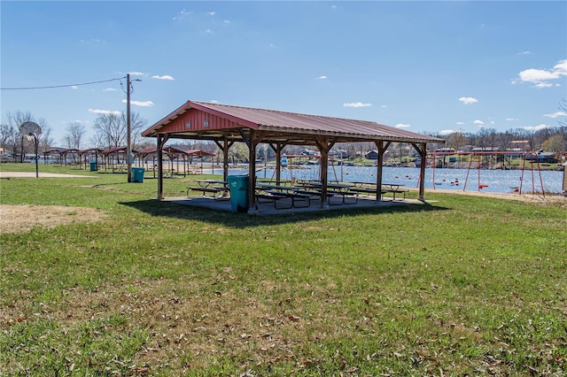 surrounding community featuring a water view, a gazebo, and a yard