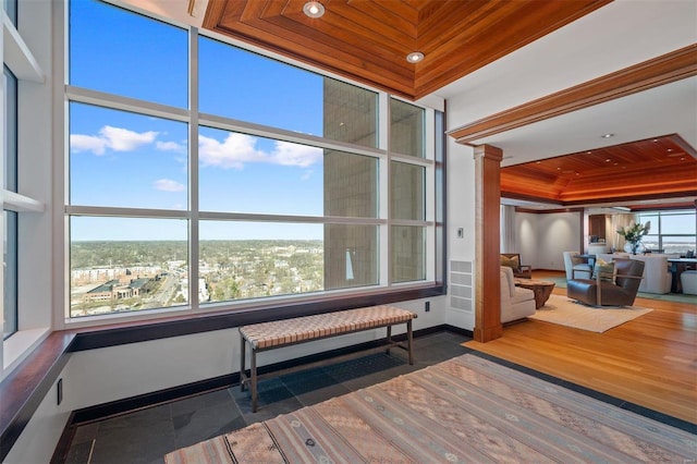 interior space featuring dark hardwood / wood-style flooring, a wall of windows, and wooden ceiling