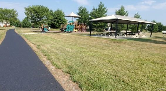 view of nearby features with a gazebo, a playground, and a lawn