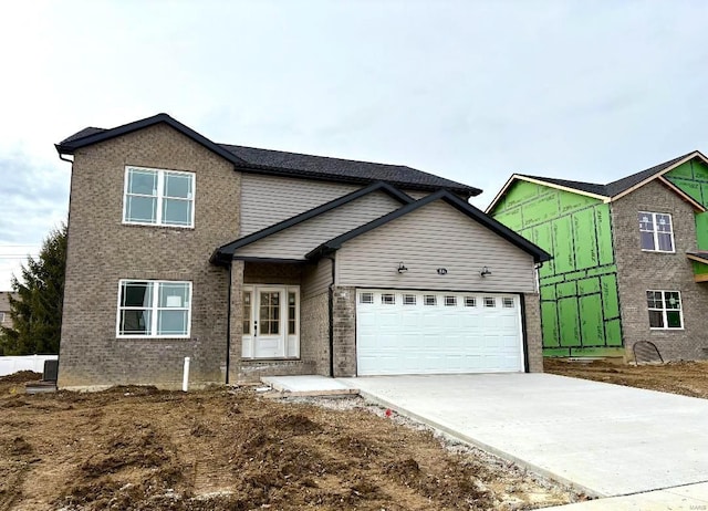 view of front of property with a garage